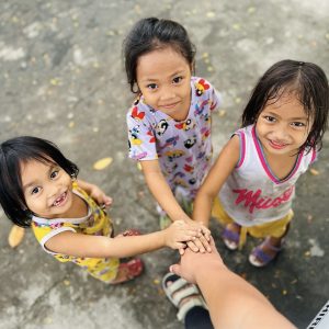 Girls with hands together